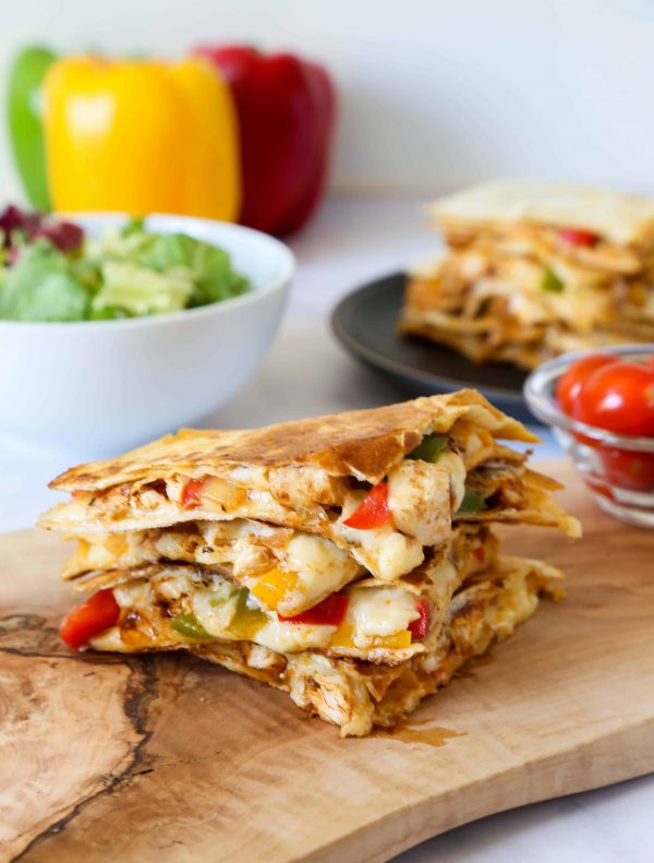 Easy and quick cheesy and flavourful chicken fajita quesadillas, with a generous amount of grated cheese without all the extra calories.